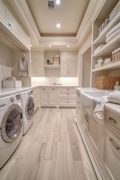 a laundry room with washer and dryer in it