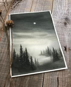 an image of a forest scene with pine trees and the moon in the sky above it