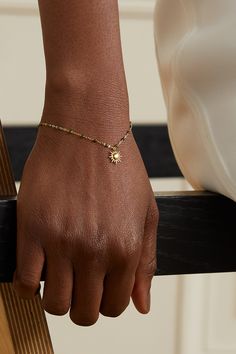 gigi CLOZEAU captures the mood of summer with this bracelet, which will have you smiling every time you notice it. Handcrafted from 18-karat gold, it's dotted with the jeweler's signature resin beads and glistens with a polished sun charm.