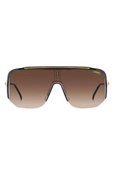 Big, bold design elevates head-turning sunglasses fitted with an oversized shield lens. 99mm lens width; 1mm bridge width; 140mm temple length 100% UV protection Injection-molded polyamide Imported Eye Glass, Shield Sunglasses, Mens Eyewear, Brown Gradient, Bold Design, Eyewear Sunglasses, Brown Gold, Uv Protection, Turning