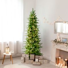 a living room with a christmas tree in the corner and presents on the floor next to it