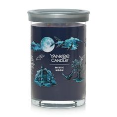 yankee candle mystic moon with an image of a castle on the front and blue sky in the background