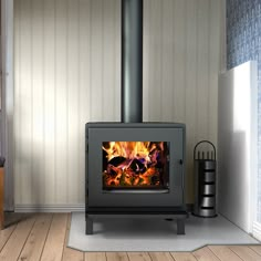 a wood burning stove sitting on top of a hard wood floor