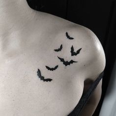 a woman's chest with bats on it