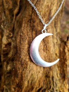 Large crescent moon pendant necklace, makes a great statement to an outfit! Pendant Size: 4.4x1.3 inch. Necklace length: 18inch Silver colour zinc alloy Silver Moon Phase Charm Necklace, Silver Metal Moon Phase Charm Necklace, Silver Crescent Moon Phase Charm Necklace, Silver Moon Charm Jewelry In Alloy, Nickel Free Half Moon Silver Necklace, Nickel-free Silver Half Moon Necklace, Nickel-free Silver Half-moon Necklace, Silver Alloy Jewelry With Moon Charm, Silver Alloy Necklace With Moon Charm