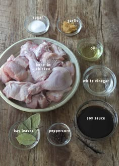 ingredients to make chicken wings in small bowls on a wooden table with text above them