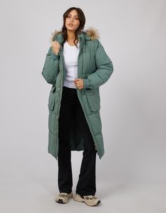 DESCRIPTION Embrace the cooler seasons with the Active Fur Longline Puffer in a refreshing green hue by All About Eve. This puffer jacket is a true cold-weather ally, featuring a snug faux fur-lined hood that brings a touch of luxury to your outdoor attire. Its extended length provides extra coverage, while the cinchable waist allows for a customisable fit. The soft green shade adds a pop of colour to dreary days, and the gold-tone hardware injects a dash of glamour. Ideal for layering over a cr Set In Sleeve, Eve Online, All About Eve, Fur Hood, Summer Knitting, Detachable Hood, Australia And New Zealand, Black Blazers, Winter Looks