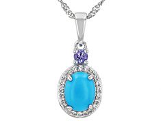 9x7mm Oval Sleeping Beauty Turquoise, 0.09ct Round Tanzanite With 0.17ctw Round White Zircon Rhodium Over Silver Pendant With 18"Singapore Chain. Measures Approximately 0.94"L x 0.40"W. 2.5mm bail. Lobster clasp with 2"extender. Accent stones primarily zircon. Turquoise Oval Jewelry With Diamond Accents, Oval Turquoise Jewelry With Diamond Accents, Turquoise Oval Jewelry With Halo Setting, Oval Turquoise Jewelry With Halo Setting, Oval Turquoise Gemstones With Accents, Oval Turquoise Gemstones With Accent Stones, Pendant With Chain, Sleeping Beauty Turquoise, Silver Pendant