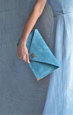 Soft Symmetria Clutch in jeans blue.The perfect bag for all occasions!Ideal for cocktail and parties or for business meetings depending the size you choose. It comes in two sizes, small and large.You can use it as a chic briefcase for your work or as a modern large clutch for a night out.This adorable large clutch is handmade out of a genuine, lux Italian jeans blue suede leather.-Small size fits all your essentials, wallet, keys, mobile, cosmetics etc. -Large size fits a 15" laptop, ipad, porto Blue Rectangular Clutch For Everyday, Blue Envelope Clutch For Everyday Use, Blue Envelope Bag For Daily Use, Blue Pouch Clutch For Everyday Use, Blue Everyday Pouch Clutch, Modern Blue Pouch Clutch, Everyday Blue Pouch Clutch, Blue Leather Chic Clutch, Blue Chic Leather Clutch