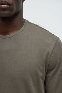 Model Height: 6'2 - Wearing Large Big & Tall: Height 6'3- Wearing XXXL Available In Black, Burgundy, Grey, Navy, Olive And White T-Shirt Crew Neck Long Sleeve 100% Cotton Imported | Mens Essential Long Sleeve Scallop Tee Shirt in Olive Green size Small by Fashion Nova Tall Height, Olive Fashion, Mens Essentials, White T Shirt, Big & Tall, Model Height, White Tshirt, Mens Tees, Olive Green