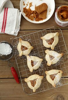 several small pastries on a cooling rack