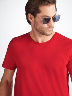 Our red Riley crew-neck t-shirt is cut from 100% fine gauge pima cotton for a luxurious essential. This super soft fabric is lightweight and breathable making it perfect for enjoying the sun in comfort. Our incredibly soft pima cotton is superior to standard cotton thanks to the extra long staple fibres which produce a more refined and silkier touch. These unique properties also ensure the fabric won't twist or pill and the vibrant colour lasts, wash after wash. The short-sleeve crew-neck design Classic Red Tops For Everyday, Classic Red Tops For Everyday Wear, Classic Plain Summer T-shirt, Red Stretch Casual T-shirt, Relaxed Fit Pima Cotton T-shirt For Summer, Summer Relaxed Fit Pima Cotton T-shirt, Summer Relaxed Pima Cotton T-shirt, Red Cotton Half Sleeve T-shirt, Red Cotton Short Sleeve T-shirt