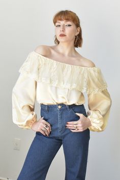 "Vintage 1970s Top / 70s Gunne Sax Satin Blouse / Peach Pink ( S M ) ~T H E R U N D O W N~ Modern Size: S/M Materials: Acetate/nylon blend Condition: Excellent vintage condition Brand: Gunne Sax Jessica's Gunnies ~F U L L D E T A I L S~ Gorgeous 1970s Gunne Sax blouse done in peachy satin rayon. Elastic neckline that can be worn on or off shoulder, lace trim, long wide sleeves with elastic trim, and loose flowy cut. Pullover style, no closures. ~ M E A S U R E M E N T S~ Bust: Up to 40\" Waist: 70s Mode, Satin Bluse, F U, Satin Color, Gunne Sax, Satin Blouse, Satin Top, Peach Pink, Wide Sleeves