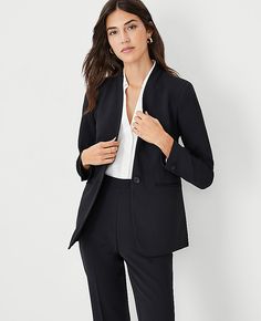 Impeccably tailored in refined crepe, our long collarless blazer is an endlessly versatile topper. V-neck. Long button-open sleeves allow for versatility in styling. One-button front. Front besom pockets. Back vent.,Bullet3:27" long,Hit:Hits at hip,Imported:Imported,Fit:Tailored fit,Fabrication:95% Polyester, 5% Spandex,Garment Care:Machine Washable The Long Collarless Blazer in Fluid Crepe by Ann Taylor Size regular - 14 Black Women's Blazers, Long, Sleeve, Suit, Jackets, Jackets, 95%, Polyeste Collarless Blazer Outfits For Women, Tailored Suit Women, Bright Winter Color Palette, Modern Tailoring, Collarless Blazer, Petite Blazer, Long Sleeve Suit, Open Sleeves, Office Photo