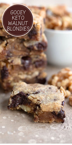 A walnut blondie with a bite taken out of it on a brown table. Walnut Recipes Keto, Keto Dairy Free Dessert, Keto Walnut Recipes, Keto Sweet Treats, Keto Chocolate Chips, High Fat Foods, Keto Brownies, Best Keto Diet, Low Carb Cookies