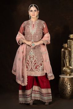 Red full sleeves A-line kurta with all over persian jaal embroidery using dori, thread and sequin highlights. Paired with a matching fleur embroidered palazzo and a contrasting baby pink scallop border fleur motif embroidered organza dupatta. - Aza Fashions Red Unstitched Designer Wear Sharara, Red Unstitched Sharara For Designer Wear, Designer Unstitched Red Sharara, Designer Red Unstitched Sharara, Red Palazzo Set With Dabka In Traditional Drape, Designer Red Resham Embroidery Sharara, Red Chanderi Palazzo Set With Dabka Detail, Red Designer Wear Sets With Resham Embroidery, Dabka Palazzo Set For Navratri Reception