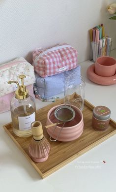 various items are arranged on a wooden tray