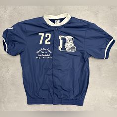 a baseball jersey with the number twenty one on it and an image of a man riding a bike