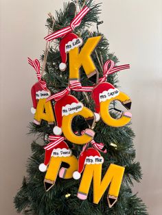 a christmas tree decorated with letters and ornaments