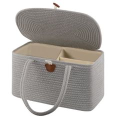 an open gray wicker box with two compartments on the front and one compartment in the back