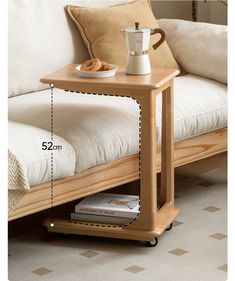 a wooden table with a coffee pot on it and a book shelf underneath the table