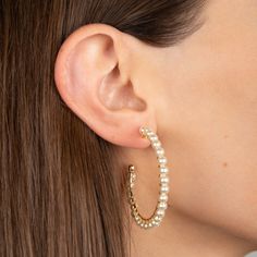 Gold plated hoop earrings with hand wired pearls. 1.75" diameter Gold plated sterling silver hoops and wire Simulated pearls Pierced Earrings Small Hoop Earrings With Pearl Chain, Metal Hoop Earrings With Pearl Drop, Hoop Earrings With Pearl Chain, Metal Hoop Pearl Earrings With Pearl Charm, Small Hoop Metal Earrings With Pearl Drop, Metal Hoop Earrings With Pearl Charm, Small Metal Hoop Earrings With Pearl Drop, Pearl Hoop Earrings With Pearl Charm, Pearl Chain Hoop Earrings