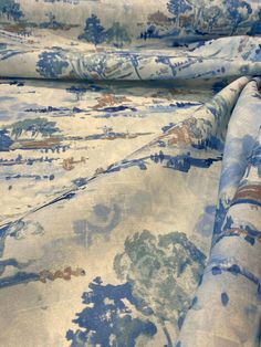 the fabric is blue and white with trees on it