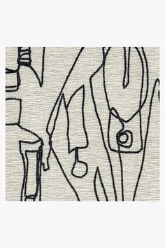 an abstract drawing with black and white lines on the side of a piece of fabric