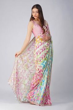 Pink and multi color pre-stitched saree with all over leaf print, attached draped pallu, pleated details, scalloped gota and lace border details. Comes with pink padded blouse with scattered sequin work. - Aza Fashions Saree Blouse Styles, Lehenga Blouse Designs, Fancy Sarees Party Wear, Sari Blouse Designs, Simple Sarees, Saree Designs Party Wear, Saree Trends, Latest Sarees, Indian Designer Outfits