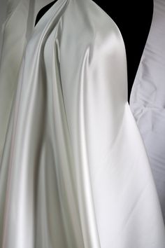 Elegant Satin Finish Fabric For Wedding, White Satin Finish Fitted Gown, Elegant Wedding Fabric With Satin Finish, Elegant Satin Fabric For Wedding, White Silk Gown For Ceremonies, Elegant Wedding Satin Fabric, Elegant Cream Fabric For Wedding, Wedding Silk Fabric With Satin Finish, White Satin Gown For Ceremony