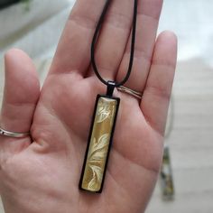 "Discover the perfect fusion of artistry and fashion with this Long Rectangle Pendant Necklace!  Elevate your style, captivate attention, and make a statement that's uniquely you. 🎨 This pendant tells a story through its abstract and colorful mixed media design. Crafted by a skilled artist, this pendant is truly one of a kind. 🌼 This necklace is more than an accessory; it's a reflection of your personality. Add an artistic touch of wearable art to your every day.  🎁 This necklace could be a perfect gift for a woman in your life who appreciate creativity, uniqueness, and quality. Product Details: ✨ Materials: This pendant feature an abstract, colorful mixed media design sealed with a clear glass cabochon dome, preserving the intricate design while adding a captivating 3D effect. ✨ Chain: Black Jewelry With Artistic Design As Gift, Yellow Necklace With Unique Variations For Gift, Unique Yellow Necklaces For Gifts, Rectangular Large Pendant Jewelry Gift, Handmade Yellow Rectangular Jewelry, Gift Jewelry With Large Rectangular Pendant, Unique Multicolor Rectangular Necklace, Unique Multicolor Necklace, Black Wearable Art Jewelry As Gift