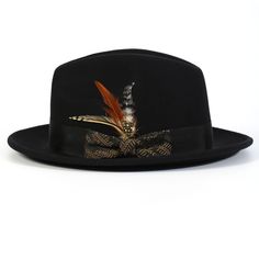 Unveil a new level of elegance with our Black/Khaki with Matching Grossgrain Ribbon 2 1/2" Wool Felt Fedora Hat from the Spectara Collection. This impeccably designed hat is crafted from top-tier wool, promising both comfort and long-lasting wear. Its bold black shade provides a versatile foundation, while the feather accent offers a splash of vibrant color. Wrapped with a textured ribbon that adds an extra layer of sophistication, this hat is a quintessential piece for any fashion-forward wardr