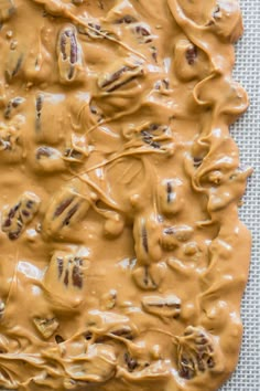 a pan filled with peanut butter frosting on top of a table