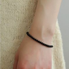 Add a touch of sophistication to your wrist with our Black Onyx Beaded Bracelet—a sleek and versatile accessory that seamlessly blends the timeless beauty of black onyx beads with a minimalist design. Metal: Recycled Sterling Silver Gemstone: Black Onyx 4mm Length: 170mm Weight: 5g Onyx Bead, Black Agate, Unique Gemstones, 925 Silver Jewelry, Deep Black, Swarovski Pearls, Summer Clothing, Keep Jewelry, Smokey Quartz