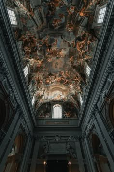 the ceiling in an old building with paintings on it