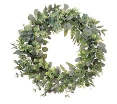 a wreath made out of green leaves and greenery