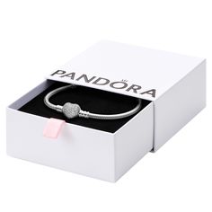 PRICES MAY VARY. Snake Chain Heart Bracelet: Set your heart a-flutter with this romantic PANDORA charm bracelet; pair it with other PANDORA bracelets for a multi-layered look Compatible with PANDORA Moments: PANDORA Moments is a way to say something about who you are through every charm and bracelet you choose and how you choose to wear it Features CZ: Cubic zirconia could be said to be the jewel in PANDORA's crown, making up the majority of stones we use in our jewelry because it optically look Crown Making, Pandora Collection, Real Christmas, Chain Heart, Hijab Styles, Snake Chain Bracelets, Gold Charm Bracelet, Pandora Charm, Broken Chain