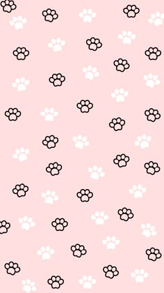 a pink background with black and white paw prints