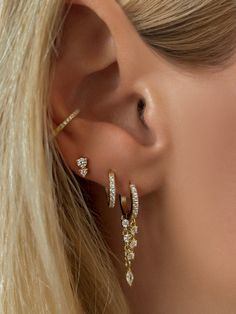 A day time version of the Aura earrings. Featuring a double chain with shimmering stones and a single marquise-shaped gem delicately suspended at the end. They’re perfect for everyday wear and stacking with your favorite pieces.Don’t miss the longline size too!Stone: Cubic Zirconia Total length including huggie: 1.25"Materials: Sterling Silver & 14K Gold Vermeil Jewelry Stack Earrings, Two Earings Piercings Ideas, Gold Earring Stack Ideas 3 Holes, Gold Earing Stacks, 3 Earrings Piercing Ideas, Gold Dangly Earrings, Two Piercings Ear Ideas, Two Earings Piercings, Eating Stack