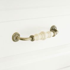 a white door handle with two handles on it