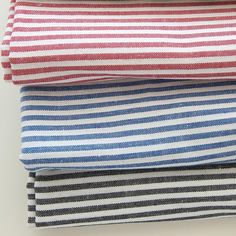 four different striped fabrics stacked on top of each other