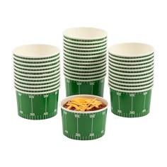 green and white paper cups filled with pasta on top of each other, all in different sizes