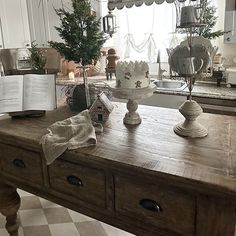 a kitchen counter with an open book on it