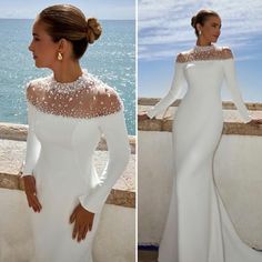 a woman in a white dress standing next to the ocean and looking off into the distance