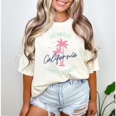 Looking for a cute versatile top to wear? Make sure to grab one of our Graphic tees! This soft and comfortable graphic tee is the perfect top for any outfit. It can be paired with biker shorts, jeans, or even a simple skirt/dress! This tee is true-to-size, so be sure to order your regular t-shirt size! If you are looking for a more oversized look, make sure to size up! Cream T-shirt With Text Print In Relaxed Fit, Oversized Bleached T-shirt For Summer, Soft-washed Cream Top For Spring, Spring Soft-washed Cream Top, Spring Cream Soft-washed Tops, Spring Cream Soft-washed Top, Spring Crew Neck Bleached Tops, Summer Beige Crew Neck Top, Summer Acid Wash T-shirt With Text Print