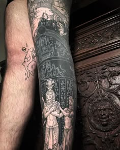 a man's leg with tattoos on it and an image of a woman standing next to him