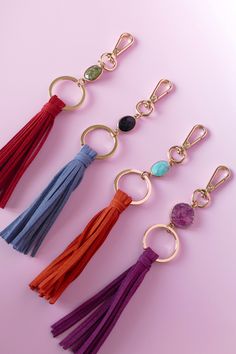 four tasseled key chains with different colors