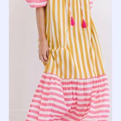 I LOVE this dress! The cutest summer pink and yellow stripe in a 3/4 sleeve maxi. The fun stripes and tassel details are what make this flowing dress a favorite! Wear it day or night, by the pool, at the beach and or out with friends. It's fully lined so no worries about that. Pair it with our cute Criss Cross Wedges or a flat sandal. You will reach for this cute dress all the time-so easy! Just throw it on and go! 100% Cotton One Size: 2-10 Striped Maxi Length Beach Cover-up Dress, Pink Maxi Dress With Tassels, Striped Summer Maxi Dress For Vacation, Summer Striped Maxi Dress For Vacation, Striped Beachwear Dresses For Vacation, Striped Maxi Dress For Summer Beachwear, Summer Maxi Dress With Tassels, Pink Maxi Dress With Tassels For Vacation, Striped Beachwear Dresses For Spring