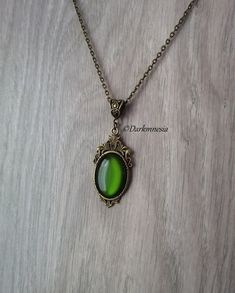 Necklace with pendant and green stone.Dimensions:Chain: 48 centimetersPendant: 4.5 centimeters high and 2.3 centimeters wideThe length can be adjusted on request at the time of purchase, at no additional cost.Materials used: zinc alloy, resin.☽☽☽☽☽☽☽☽☽☽☽☽☽☽☽☽☽☽☽☽☽☽☽☽☽☽☽☽☽☽☽☽☽☽☽☽☽☽This jewel will be delivered to you in a small organza pouch and sent by registered letter for better reception.☽☽☽☽☽☽☽☽☽☽☽☽☽☽☽☽☽☽☽☽☽☽☽☽☽☽☽☽☽☽☽☽☽☽☽☽☽☽To keep your jewelry in perfect condition, store them away from humid Green Amulet Necklace, Gold Brass Fantasy Necklaces, Gold Fantasy Brass Necklaces, Fantasy Gold Brass Necklaces, Bronze Metal Fantasy Necklace, Fantasy Style Bronze Metal Necklace, Bronze Gothic Jewelry For Gift, Green Brass Necklace For Gift, Green Brass Jewelry For Formal Occasions