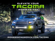 a truck driving down a dirt road with the words, elevate your tacoma ironman 4x4